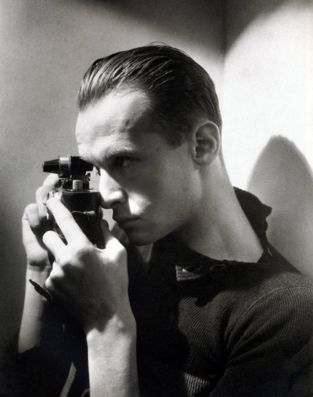A young Henri Cartier-Bresson with his Leica 35mm rangefinder camera