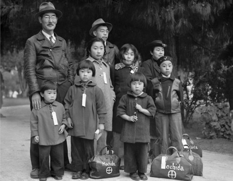 Tagged Japanese-American family waits to be relocated to an interment camp, by Dorothea Lange, 1942 - World War II