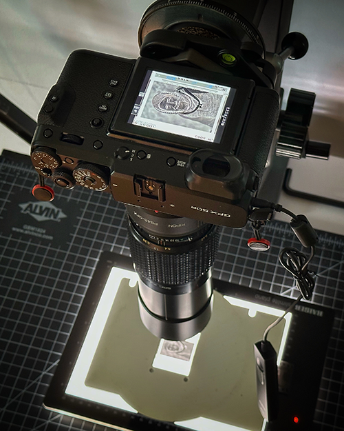 Copy setup with Fujifilm GFX 50r, Pentax 645 120mm f/4 Macro Lens, Kipon Pentax to GFX lens adapter, Omega D2 645 negative carrier, Kaiser SlimLite Plano, and vintage Polaroid MP-4 Copy Stand